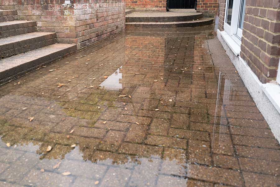 Surface water flooding on a patio